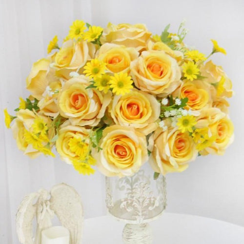 Floral centrepiece yellow rose daisy
